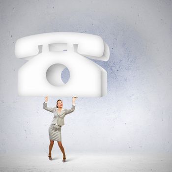 Image of businesswoman holding macro sign of telephone