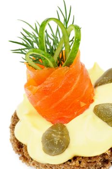 Delicious Snack with Smoked Salmon, Cheese Cream, Greens, Capers, Cucumber and Whole Grain Bread closeup on white 