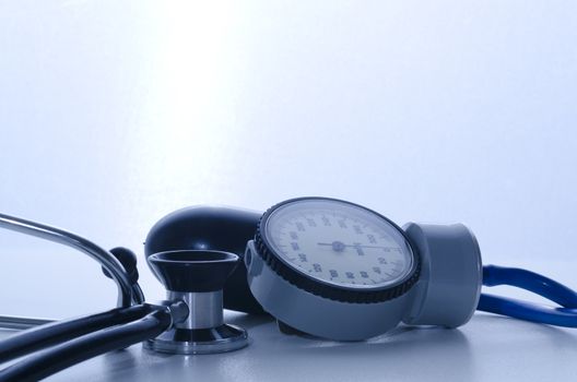 stethoscope and sphygmomanometer medical instruments with blue lights