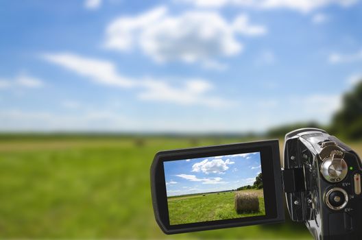 sharp picture of natural landscape seen through digital camcorder and displayed on LCD display