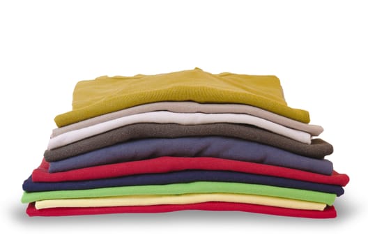 colorful stack of folded clothes isolated on white background
