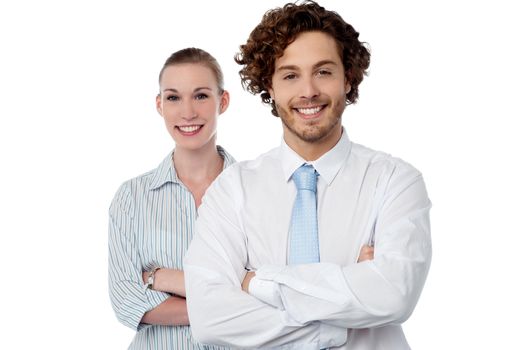 Confident business colleagues posing arms crossed