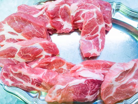 Fresh entrecote steaks prepared on silver tray