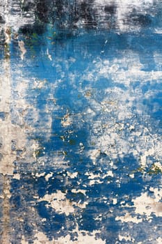 Old plaster with remnants of paint on the wall