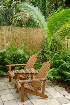 Adirondack chairs in  warm tropical location in the summer on patio