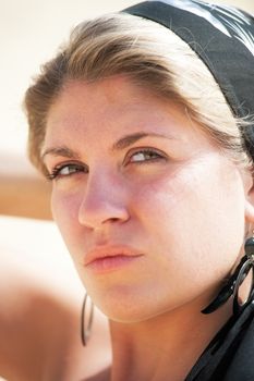 Portrait of a young girl in a headscarf.