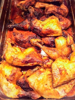 Fried chicken in a pile in metal tray