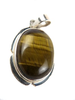 A silver pendant with a semi precious stone called tigerstone in it, isolated on white studio background.
