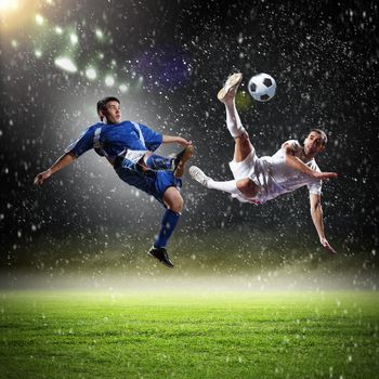 Image of two football players at stadium