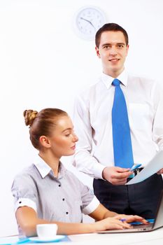 Business woman working with her collegue in office