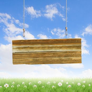 Wooden blank banner hanging on ropes. Place for text