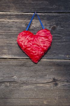 red heart symbol on old wooden farm barn wall