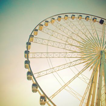 Ferris wheel with blue sky with retro effect