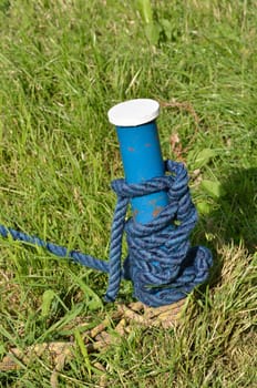 Blue mooring post with rope