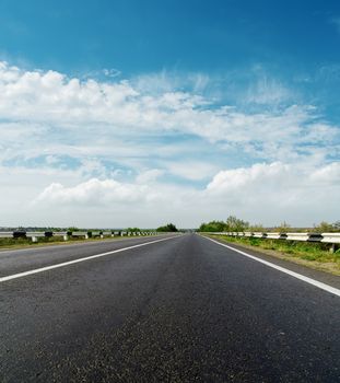 asphalt road and cloudy sky