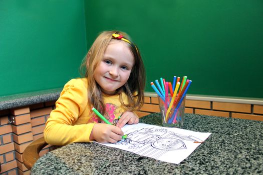 little girl with nice hair-do drawing by pencils