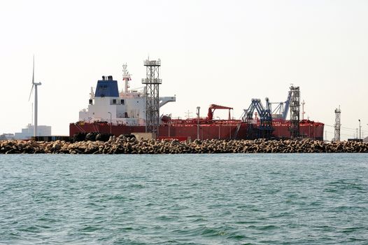 quay tanker to discharge its cargo in France with the wearing of Fos-sur-Mer beside Marseille