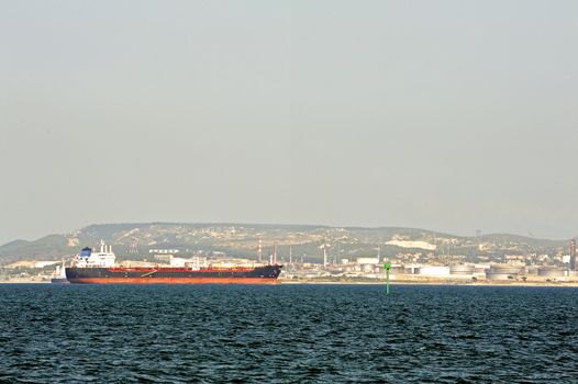 tanker on standby to discharge its cargo in France with the wearing of Fos-sur-Mer beside Marseille.