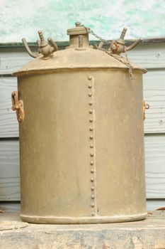 Old rusty pressure cooker in warehouse.