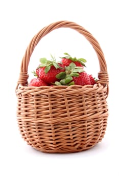 wicker basket with strawberries isolated on white