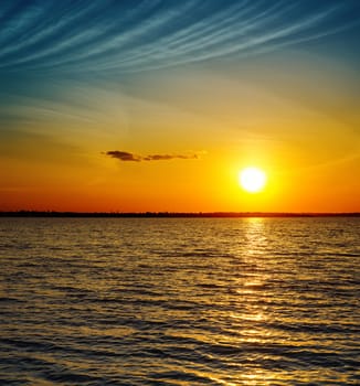 golden sunset over dark water