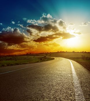 perfect sunset over asphalt road