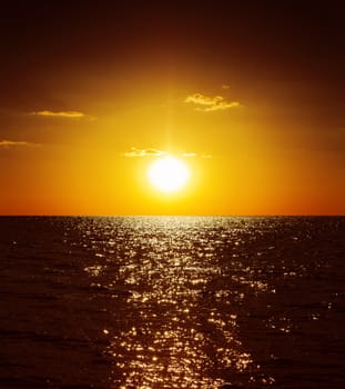 golden sunset over dark water