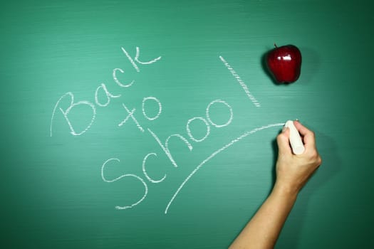 Back to School Written in Chalk on a Green Blackboard