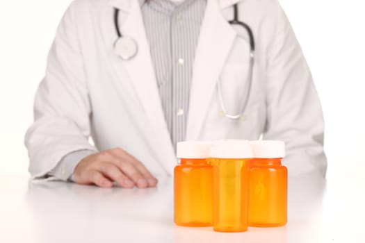 Male Doctor With Empty Orange Prescription Bottles