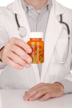 Handsome Doctor With Medication in Prescription Bottles