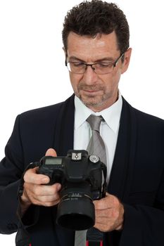 adult man photographer with digital camera dslr isolated on white 