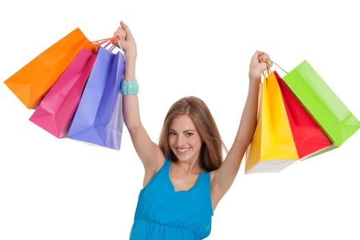 attractive young woman with colorful shopping bags isolated on white background