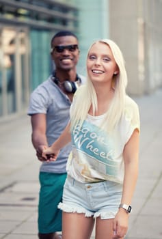 happy young couple have fun in the city summertime outdoor smiling lifestyle