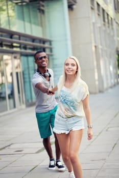 happy young couple have fun in the city summertime outdoor smiling lifestyle