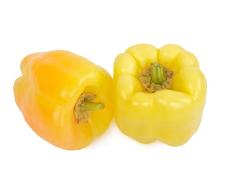 two fresh yellow peppers, studio shot, isolated on white background