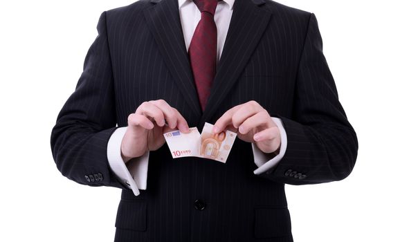 businessman tearing up euro note concept of euro zone banking crisis isolated on white background