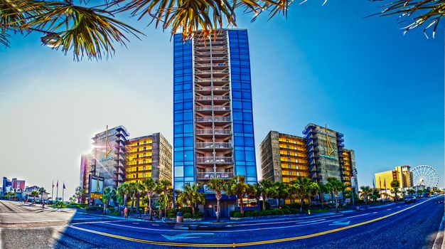 beach scene,  blue sky and hotel with sunshine