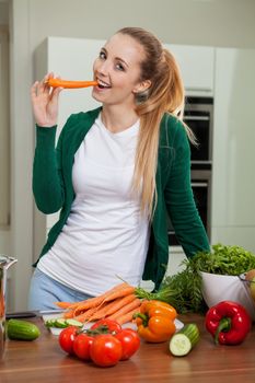 young woman cooking vegetarian food in kitchen