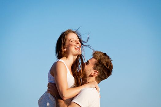 happy young couple having fun in summer holiday vacation love