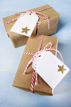 Present boxes with tags and ribbons on blue background