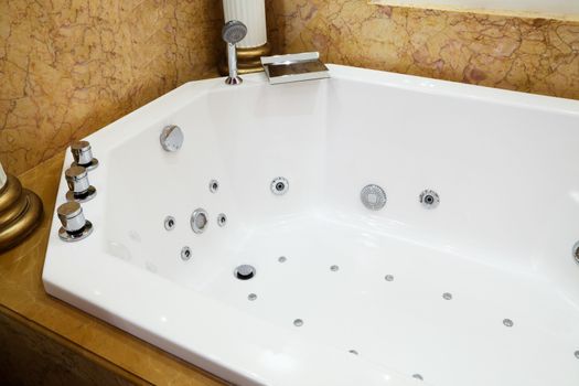 beautiful big bath in the marble bathroom