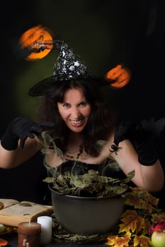 Witch making magic on Halloween night