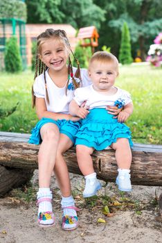 Two little sisters with the park