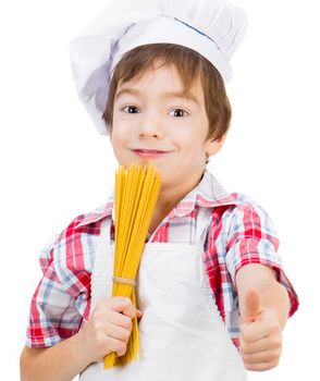 smiling little boy and raw spaghetti with thumbs up