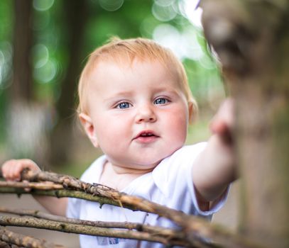 cute beautifil baby outdoors with blur background