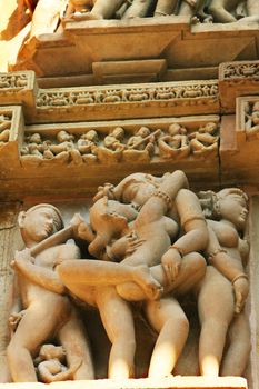 A relief with erotic scene carved on the walls of one of the Kajuraho temple complex in India