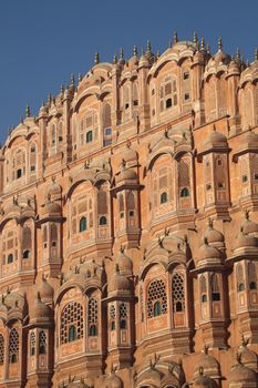 The decorative front facede of Hawa Mahal palace in Jaipur. The Palace of Winds is a popular tourist destination in India.