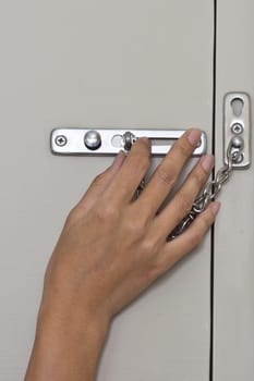 Locking up or unlocking door with hinge in hand