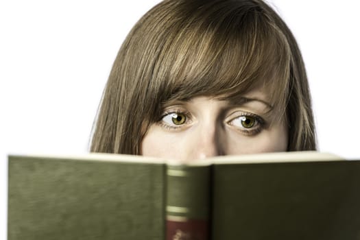 Young beautiful woman reading a book, isolated on white background