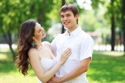 Portrait of a young romantic couple embracing each other